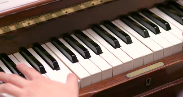 Playing piano at home alt