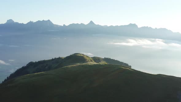 Drone Shot of Lush Green Fields on the Peak of the Schwalbenwand Mountain alt