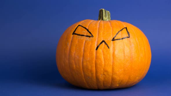 Stop Motion Animation of a Scary Face Showing Up on a Halloween Pumpkin. The Scary Jack-o-lantern