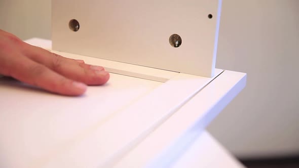 Man Mounts the Wardrobe at Home alt