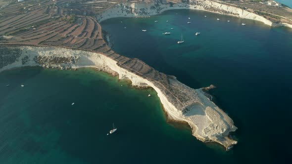 Mediterranean Headland of Malta Island in Sunset Light with Turquoise Blue Water, Aerial Slide Right alt