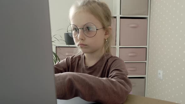 Little Schoolgirl Rejoices Using the Computer