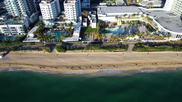 Aerial footage above the sea viewing the waves at Miami beach