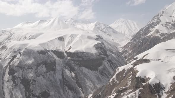 Gudauri, Georgia - April 12, 2021: Aerial view of Russia–Georgia Friendship Monument alt