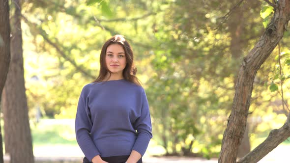 Girl Stands and Smiles alt