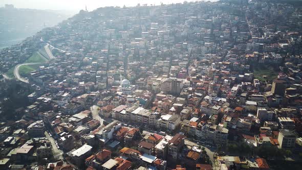 Drone view on poverty slum district and muslim mosque alt