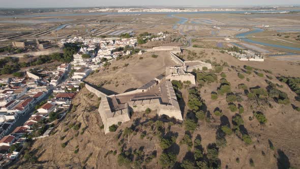 Aerial circular pan shot, Forte de Sao Sebastiao in old town of Castro Marim, Algarve, Portugal alt