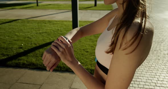 The Girl on the Morning Jog Turns on Her Smart Watch