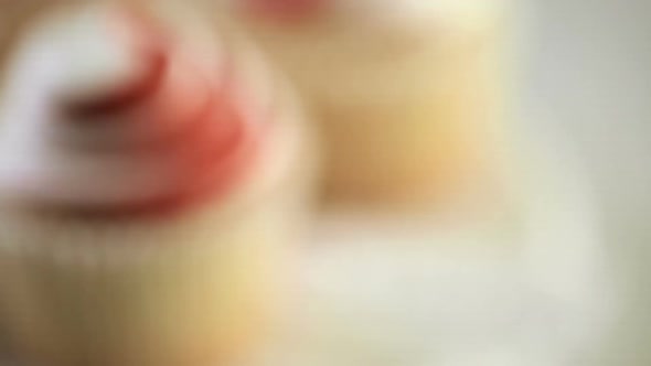 Gourmet cupcakes for Mother's Day on a wood background alt