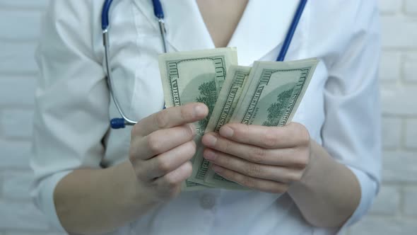 Female Doctor with Dollars