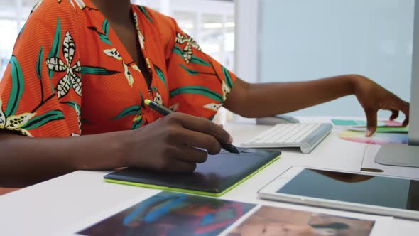 Young woman working in a creative office alt