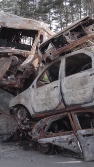 Vertical Video of a Dump of Destroyed Cars During the War in Ukraine alt