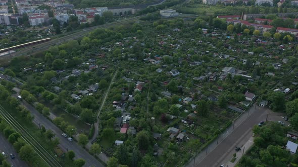 Aerial View of Block of Community Gardens in Urban Neighbourhood alt