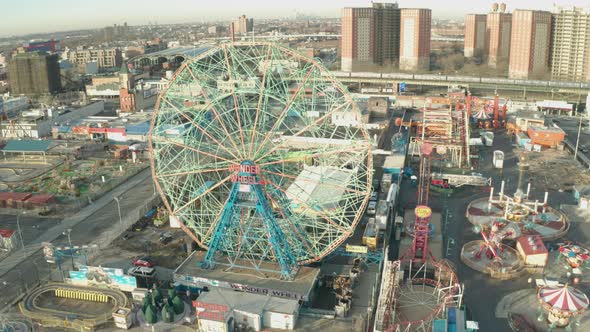 Aerial Ascending Drone Shot of Coney Island Ferris Wheel and Amusement Park