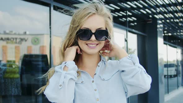 Woman in Sunglasses Posing