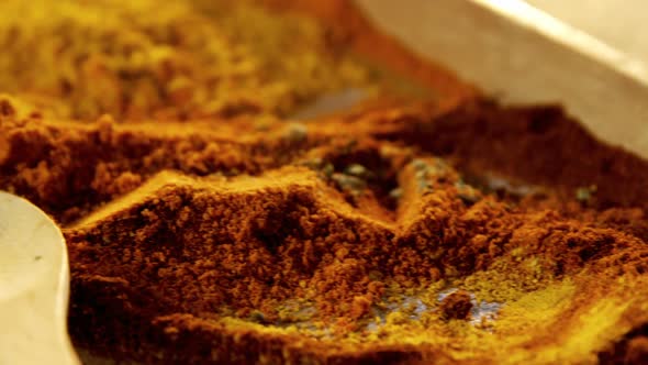 Various spices powder in wooden tray 4k alt