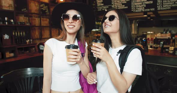 Two Girls Taking Coffee To Go