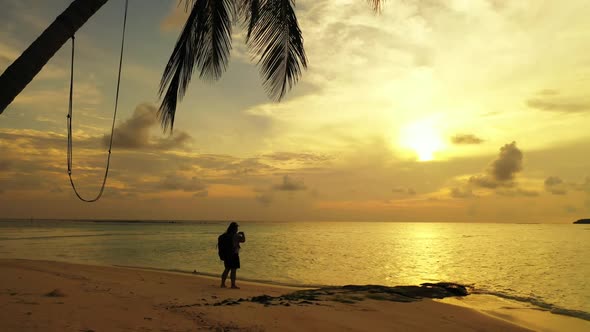 One woman sunbathes on beautiful bay beach lifestyle by shallow sea and white sand background of the alt