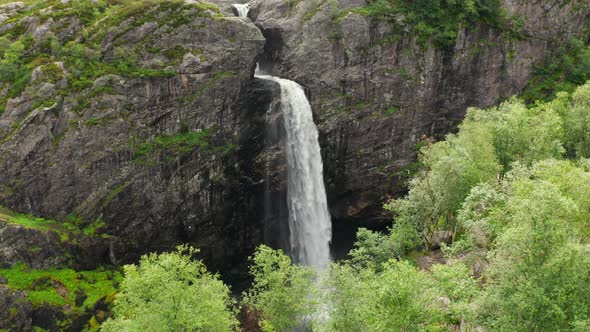 Drone Over Waterfall Into Rocky Valley alt