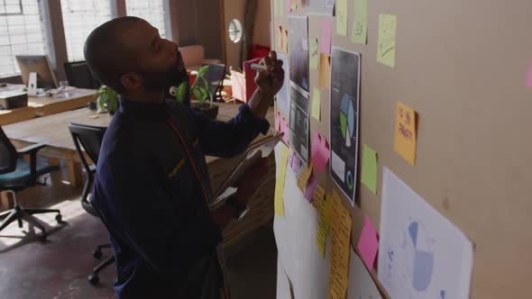 Young creative professional working in a modern office alt