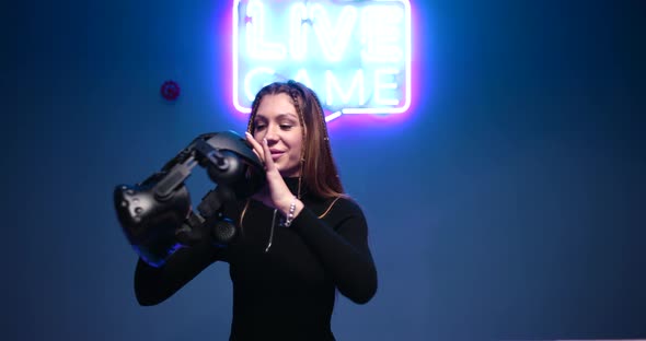 Young Woman Puts VR Glasses Game alt