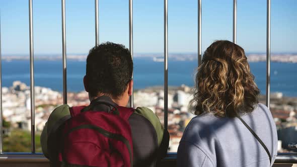 Young Family Couple at Christ the King Observation Deck Looks at Lisbon City