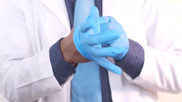 Young Doctor Wears Medical Latex Gloves Close Up alt