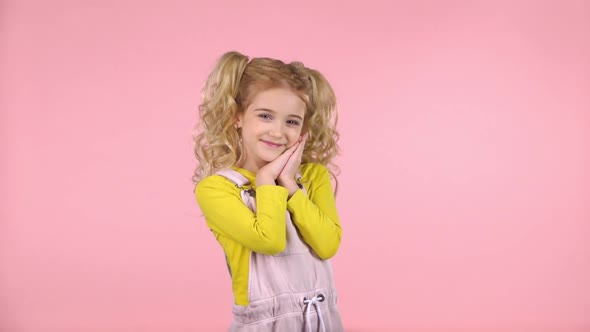 Beautiful Cute Female Is Touching Her Face and Smiling. Slow Motion alt