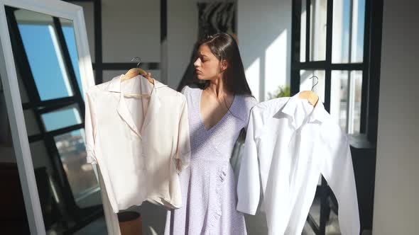 Beautiful Girl Trying Dress in Room alt