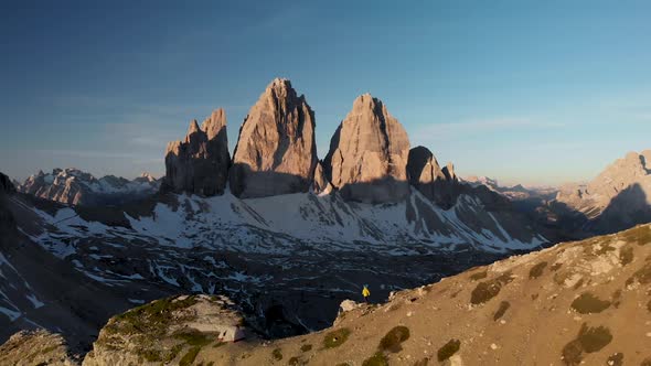 Aerial Man Hiker Walk In Front of Cadini Mountain in Dolomites Italy
