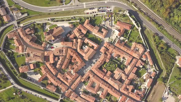 Top Down Aerial View of a Small Historic Town Venzone in Northern Italy with Red Tiled Roofs of Old alt