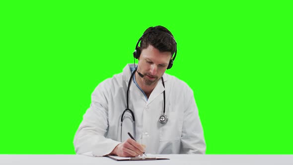 Caucasian male doctor on green screen background alt