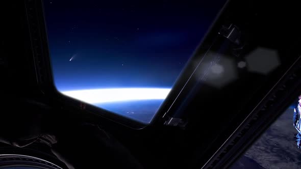 Comet Neowise rising over the Horizon as seen from the ISS. alt