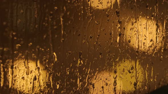 Raindrops on window pane in closeup