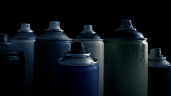 Passing Grungy Used Spraypaint Cans alt