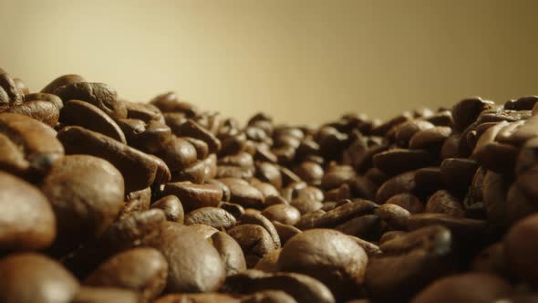 Slow Dolly Out Footage Near Yellow Roasted Coffee Beans Freshly Brewed Coffee Beans Lie on Table alt
