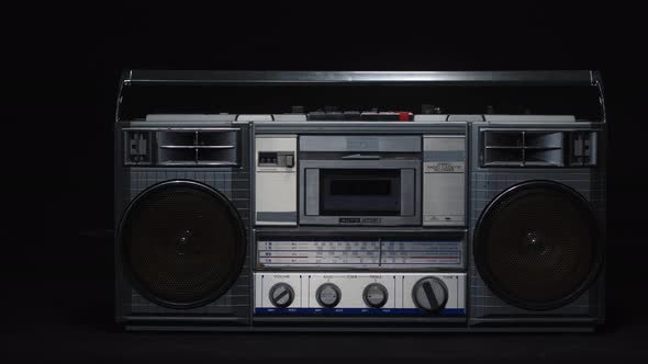Old Vintage Cassette Microphone on a Black Background alt