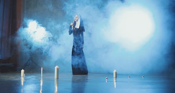 Sexy Nun Posing in a Smoke Studio alt