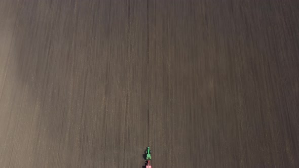 Working At The Field Tractor With The Seeder 20 alt