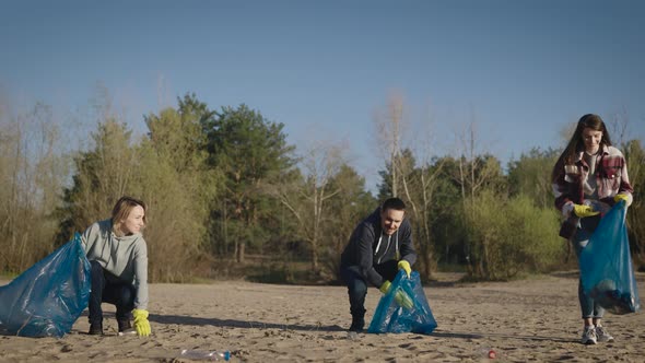 A Team of Volunteers Collects and Sorts Garbage alt