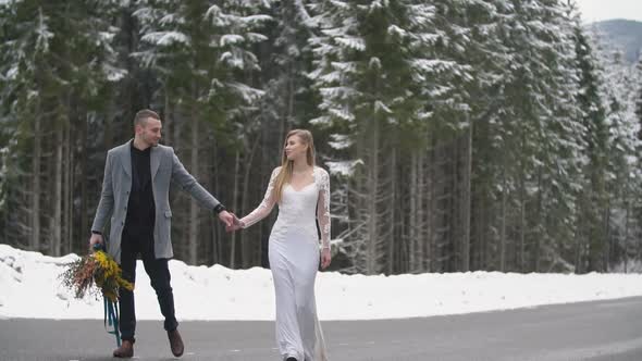 Couple Walking in the Winter Forest alt