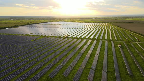 Aerial View of Big Sustainable Electric Power Plant with Rows of Solar Photovoltaic Panels for alt