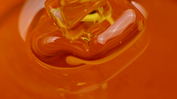 Liquid Transparent Honey Flows in Beautiful Viscous Jet Slow Motion Close Up