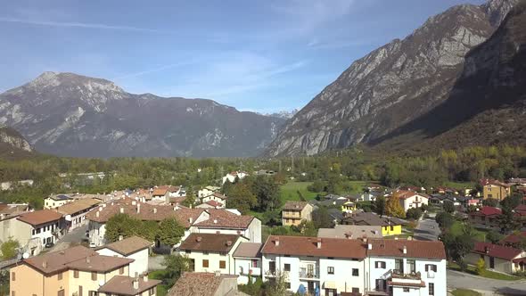 Aerial view of a small historic town Venzone in Northern Italy with red tiled roofs of old buildings alt