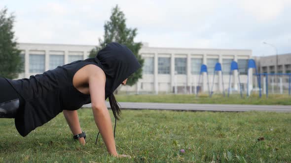 Fitness Girl Doing Push-ups with Cotton on the Stadium alt
