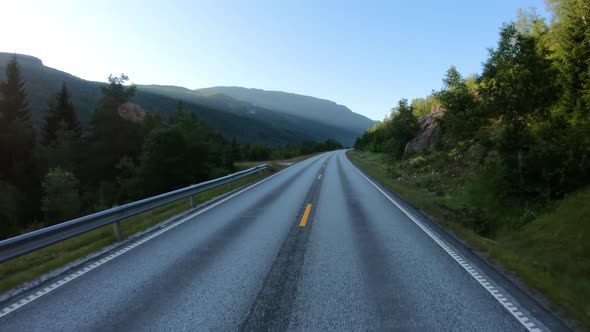 Vehicle Pointofview Driving a Car on a Road in Norway alt