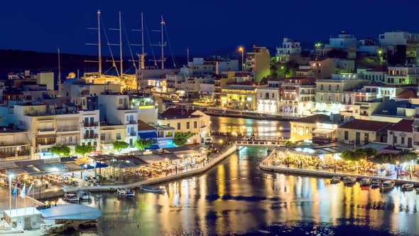 The Lake Voulismeni and Agios Nikolaos Town at Night on the Island Crete, Greece alt