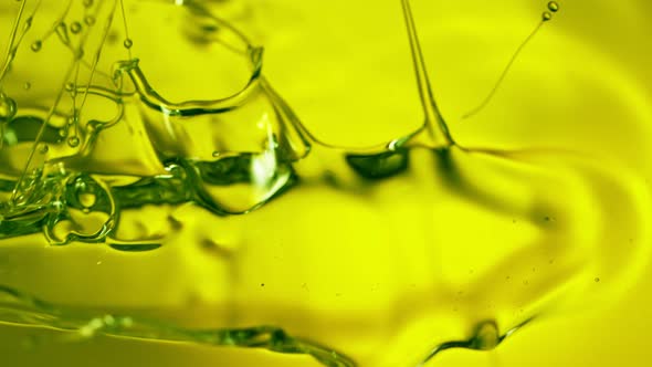 Super Slow Motion Shot of Pouring Fresh Green Olive Oil at 1000Fps alt