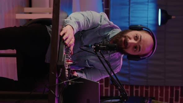 Man Vlogger Filming Video with Podcast Equipment in Studio Recording Online Vlog Using Digital alt