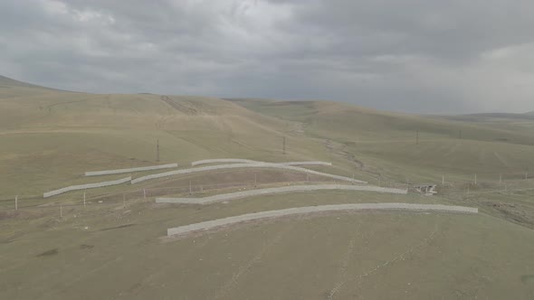 Samtskhe Javakheti, Georgia - August 28 2021: Aerial view of Snow protection fences near railroad. alt